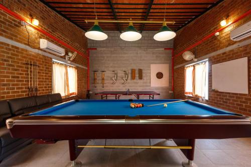 a billiard room with a pool table in it at White Lotus Villa by StayJadeJacuzziGames Room in Bengaluru