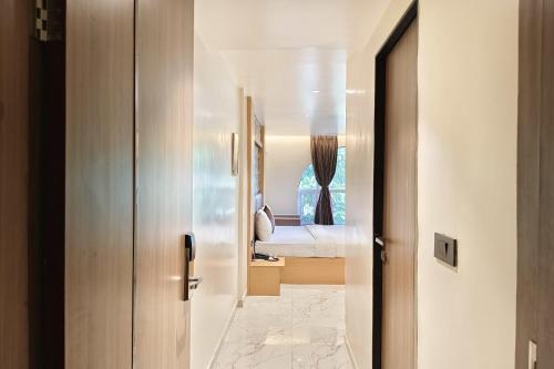 a hallway leading to a bedroom in a house at The Golden Arc in Pune