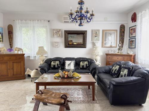 a living room with a couch and a table at Luxury Beachfront Apartments Matista in Trogir
