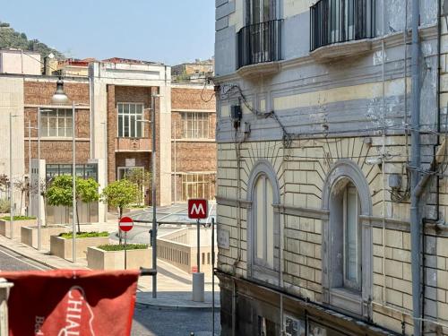 a view of a city street with a building at Chiaia Suites in Naples
