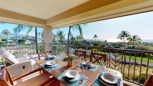 a dining room table with a view of the ocean at ❤PiH❤ OCEAN BREEZE Panoramic Ocean View Mauna Kea Resort Optional Privileges in Waimea