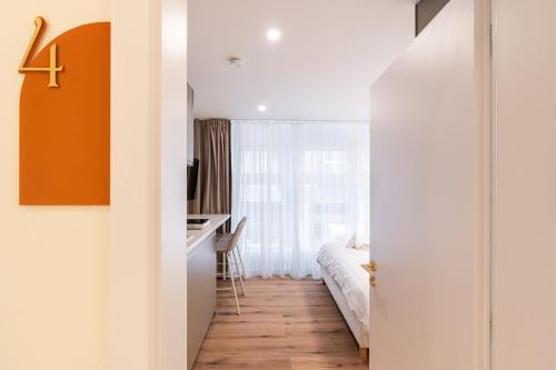 Un ou plusieurs lits dans un hébergement de l'établissement Asbóth Boutique Suites, Best Location by BQA