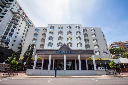a hotel building with a sign on the front of it at Novotel Darwin CBD in Darwin