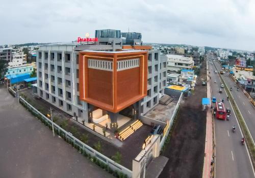 an overhead view of a building with a large building at Pravasa Hotel Vijayapura in Bijāpur