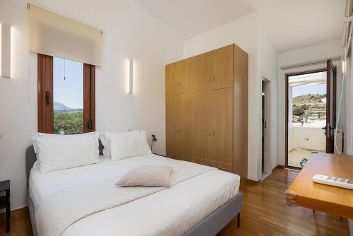 A bed or beds in a room at Villa Elesia