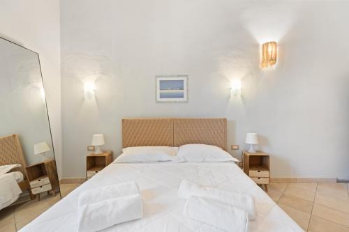 Postel nebo postele na pokoji v ubytování Le Residenze In Piazza