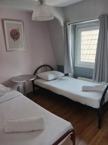 Katil atau katil-katil dalam bilik di Hotel Tamara