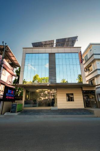 a building with a lot of windows on it at Boat Residency in Cochin