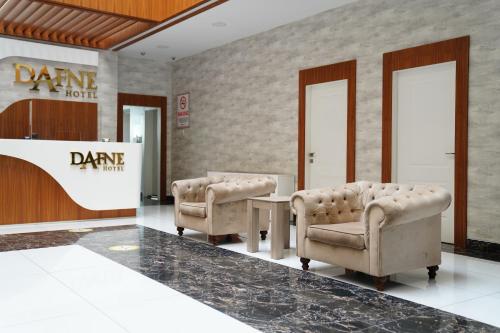a waiting room with two chairs and a table at Dafne Hotel in Ankara