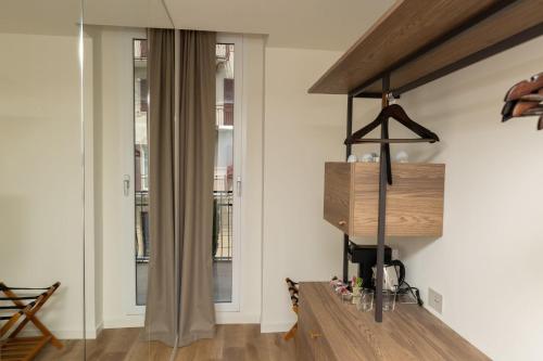 a living room with white walls and wooden floors at Splendide Riviera Boutique Art Hotel in Rapallo