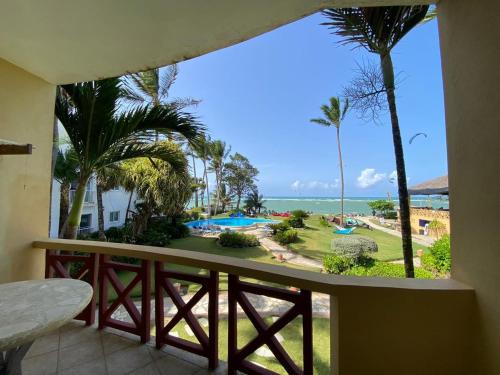 a balcony with a view of the ocean and a resort at Agualina Kite Hotel Oceanfront Apartments in Cabarete