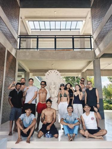 a group of people posing for a picture on a porch at Nala's Home in Uluwatu