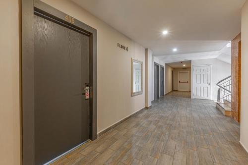 an empty hallway with a door in a building at Seven City Hotel in Antalya