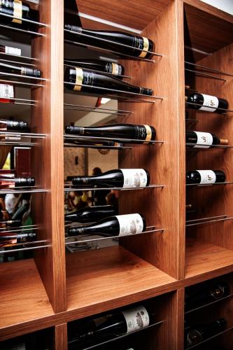 a wine rack filled with lots of wine bottles at Penzion Fortune in Dunajská Streda