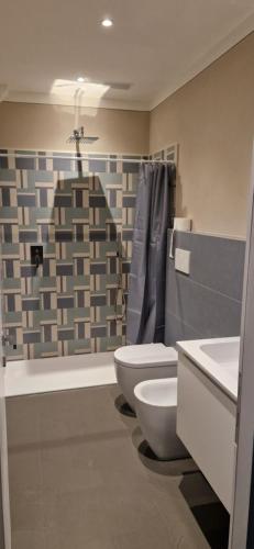 a bathroom with a toilet and a sink at Casal de' Matti - Casa Margot in Poggibonsi