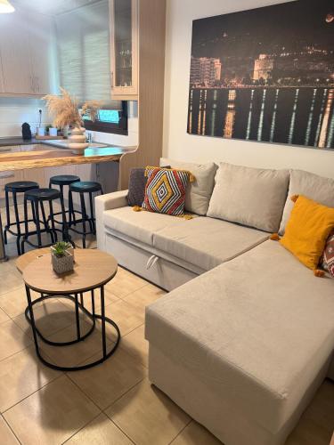 a living room with a couch and a table at Casa Di Famiglia in Thessaloniki
