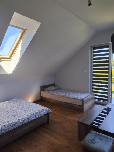 a room with two beds and a window at Relax in Stegna