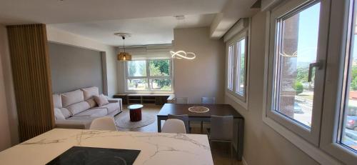 En eller flere senge i et værelse på Apartamento TERRACEO CANGAS