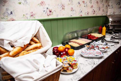 a kitchen with a buffet of food on a counter at Penzion Fortune in Dunajská Streda