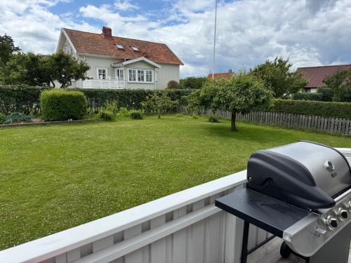 a grill on a fence in front of a yard at Villa Jan in Öckerö