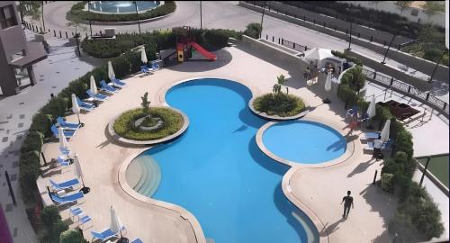 Bazén v ubytování Porto New Cairo Luxury Serviced Apartments nebo v jeho okolí