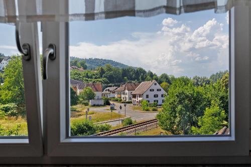 a window with a view of a town at Reiselust in Stockach