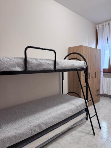 a bedroom with two bunk beds in a room at Mesciu Cesare B&B in Lecce