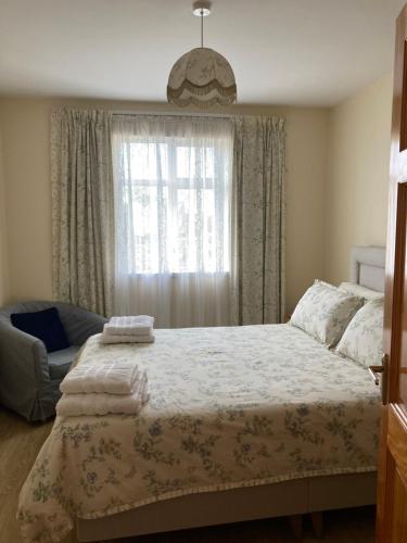 a bedroom with a bed and a window at Lake View Cottage in Flannery Bridge