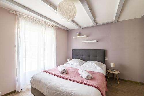 Ένα ή περισσότερα κρεβάτια σε δωμάτιο στο Au coeur du village Verzenay