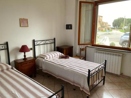 Ένα ή περισσότερα κρεβάτια σε δωμάτιο στο Cocchi house 76