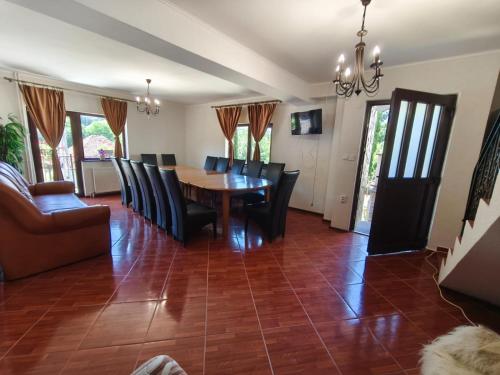 a dining room with a table and chairs at Casa Gabi in Bran