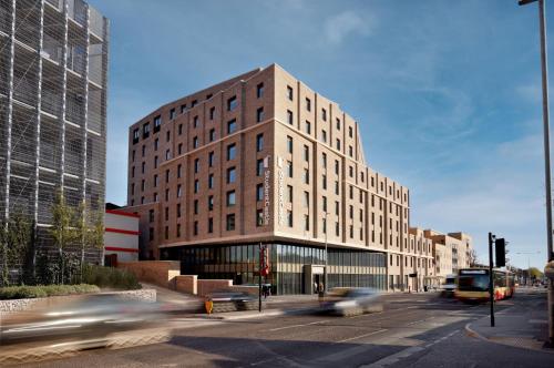 a tall building on a city street with cars at For Students Only - Student Castle in Brighton in Brighton & Hove