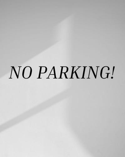 a sign that says no parking with the words no parking at Santuaria Hollywood in Hollywood