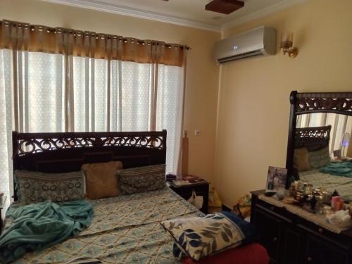 Un pat sau paturi într-o cameră la Gene B&B