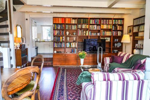 a living room with a couch and a table at The Balcony at Prinsen Canal apartment Amsterdam in Amsterdam