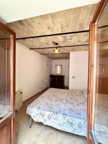 Ένα ή περισσότερα κρεβάτια σε δωμάτιο στο Casa Giannetta
