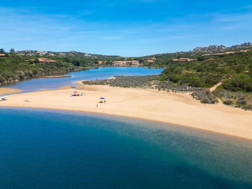 an aerial view of a beach with people on it at Felix Hotels - Residence Hotel Costa Serena in Palau