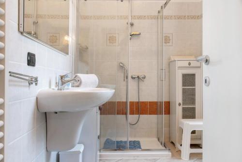 a bathroom with a sink and a shower at Casa Elisa in Luino