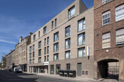 a large brick building on the side of a street at For Students Only Studios at SC Edinburgh in Edinburgh