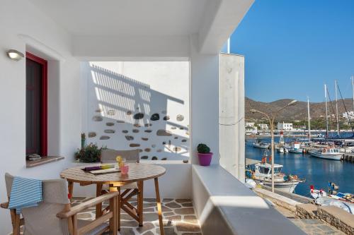 a balcony with a table and a view of a marina at Nicolas House 2 in Rakhídhion