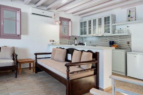 a living room with a couch and a kitchen at Nicolas House 2 in Rakhídhion