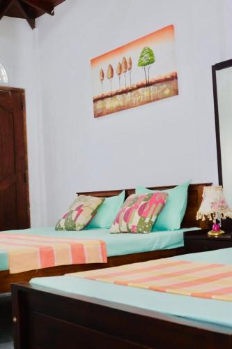 a room with two beds and a couch at VD Rest Gampola in Gampola