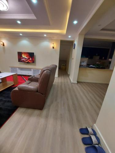 a living room with a couch and a fireplace at Nanyuki House in Nanyuki