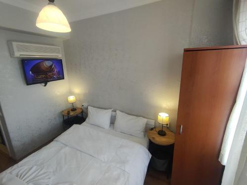 Postel nebo postele na pokoji v ubytování Hotel Antique