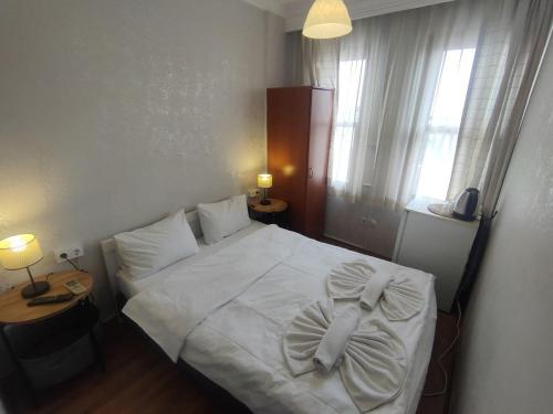Postel nebo postele na pokoji v ubytování Hotel Antique