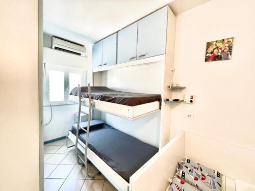 Ένα ή περισσότερα κρεβάτια σε δωμάτιο στο Appartamento Rotonda Sul Mare I ACView&Parking