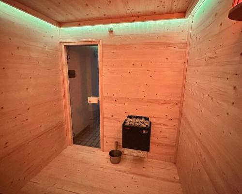 an inside view of a wooden room with a stove at Smart Resorts B&B 2 BB2 324 in Winterberg