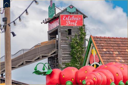 a building with a sign for a food court at Hart Backbord in Loddin