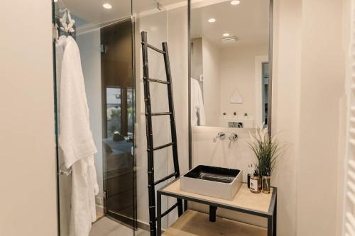 a bathroom with a ladder next to a shower at Aldi Seaside Suite in Athens