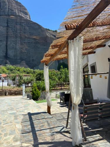 a pavilion with a mountain in the background at Paradise of Meteora A in Kastrákion